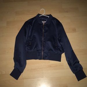 A blue with gold detail bomber jacket